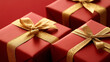 © VicPhoto - Regalos envueltos en papel rojo con lazos dorados sobre fondo rojo