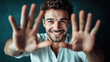 © standret - Happy young man with outstretched hands and a warm smile