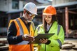 © inna717 - Supervisors using laptop at construction site