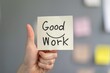 © Ali - Good work Business Concept Good work written on note pad holding in hand