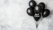 © Khalida - Black balloon with the quote Black Friday as a flat lay design Top view on a simple Black Fridaythemed background