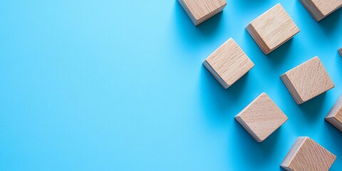 Leinwandbilder - Blank wooden block cubes on a blue background create a perfect canvas for your text. These blank wooden block cubes offer free space ideal for business concept templates and banners.