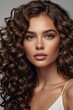 © Nia™ - Brunette girl with long and shiny curly hair . Beautiful model woman with wavy hairstyle. Fashion ,makeup and cosmetics