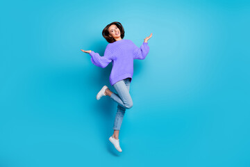 Wall Mural - full length body size view of attractive cheerful girl jumping having fun rest isolated over bright 
