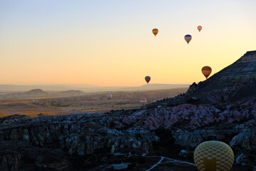 Wall Mural - landscape and hot air balloons at morning sunrise in Cappadocia, Turkey