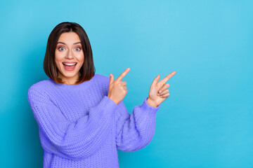 Wall Mural - portrait of attractive funny amazed cheerful girl demonstrating copy space novelty isolated over bri