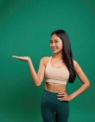 Wall Mural - Young lady woman with slim skinny body hold empty palm with blank 