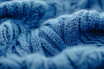 Poster - This image captures a cozy, blue knit fabric texture in an intricate pattern, offering warmth and comfort suitable for clothing and interior designs.