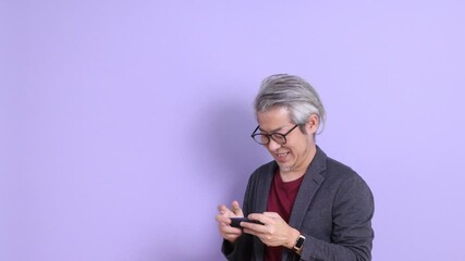 Sticker - A senior East Asian businessman in a blazer stands against a purple background.