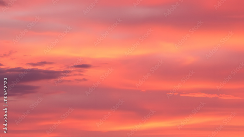  A dreamy sunset sky with hues of orange, pink, and purple blending into each other sea 