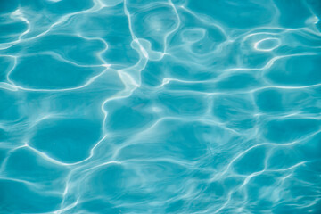 Minimalistic photo of turquoise wave ripples in a swimming pool