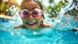 © JoZe - Cute child in a glasses plays in the pool on vacation at the water park