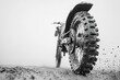 © Сергей Захаров - Close-up dirt bike tire spinning on gritty surface