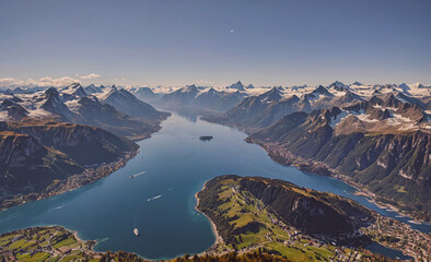 Fototapete - Mountain range with a lake in the middle. The lake is surrounded by mountains and has a small island in the middle