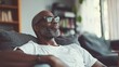 © KEOCHAN - A candid portrait of a man enjoying leisure time at home, highlighting everyday life and relaxation
