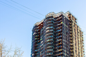 Wall Mural - high-rise apartment building renovation in evening