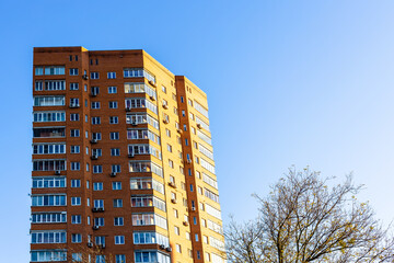 Wall Mural - high-rise apartment building lit by sunset sun