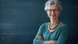 © Pavithiran - Teacher lady friendly smiling arms crossed.