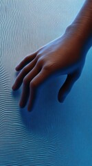 Wall Mural - Hand touching textured blue surface, evoking a sense of curiosity and exploration, AI