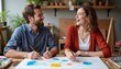 © Lena - Happy couple painting abstract art together at a wooden table in a cozy home studio with plants, perfect for creativity and relationship bonding themes