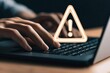© top images - Alert icon on laptop with hands typing on keyboard