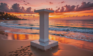 Poster - White pillar is on the beach. The sun is setting and the sky is orange. The water is calm