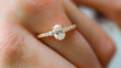 © Atmospheric stock - Elegant oval-cut diamond engagement ring on caucasian female's hand