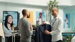 © DC Studio - Middle eastern employee assisting client to choose from the new collection of items, presenting higher fabric quality and potential color assortments. Professional retail experience. Camera A.