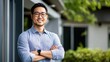 © khonkangrua - Confident Businessman Smiling Outdoors with Folded Arms in a Professional Setting Surrounded by Nature and Modern Architecture