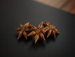 © Kachaphot - A cluster of star anise pods on a black wooden cutting board, board, wood, dark color, sweet, spice
