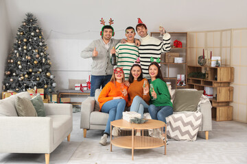 Sticker - Group of young people with champagne celebrating New Year at home