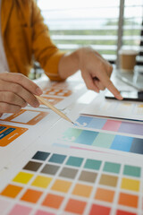 Wall Mural - a web designer is using his idea to create a digital product design project that will meet the needs