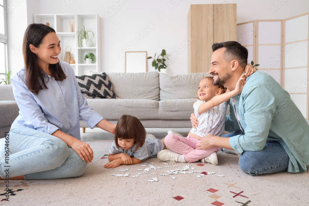 Happy family doing puzzle on floor at home