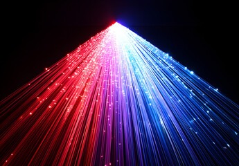 Wall Mural - A vibrant light beam with multiple colors of red, blue, and purple against a black background.