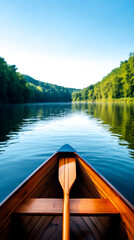 Naklejka na meble A serene view from a wooden boat on calm waters, surrounded by lush greenery and a clear blue sky.