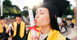 © peopleimages.com - Graduation, student and kiss diploma with celebration for education success, achievement and ceremony. Japanese university, girl and certificate on campus for learning goals, academic event and pride
