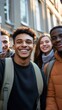 © Andrii - Diverse group of young students smiling together on campus, showcasing friendship and unity in higher education. Backpacks hint at academic life.