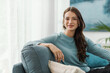 © StockPhotoPro - Beautiful young woman posing in the living room