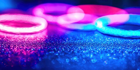Wall Mural - group of neon colored bracelets are on a blue surface
