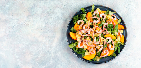 Wall Mural - Healthy salad with shrimp prawns, persimmon and green salad.