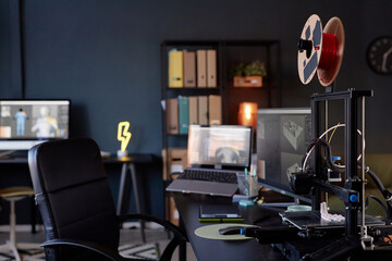 Leinwandbilder - Workspace showcasing advanced 3D printer amidst contemporary office setting. Monitor displaying design software and various organizational tools highlighting productive environment