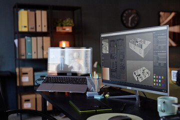 Leinwandbilder - Modern office setting with computer screen displaying architectural designs on monitor. Shelves and office supplies seen in background creating professional atmosphere