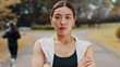 © peopleimages.com - Serious, crossed arms and portrait of woman in nature for fitness, health and wellness exercise. Outdoor, sports and athlete with confidence for cardio workout with marathon training in park in japan