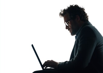 Aufkleber - A silhouette of a man working on a laptop, emphasizing focus and concentration.