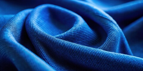 Poster - A close-up shot of a textured fabric with deep blue hues, creating a captivating swirl pattern