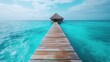 ©  lukaPixMedia - A captivating view of a bungalow situated at the end of a long wooden pier, surrounded by the endless blue of the ocean and sky, inviting a peaceful escape.