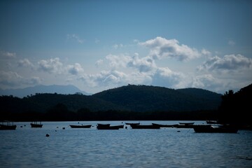 Poster - Boats floating on a calm body of water