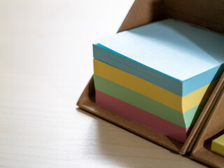 Poster - Bird's eye view of colorful sticky notes on office desk for productivity