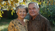 © Oleksandr - A portrait of a beautiful senior couple embracing each other outdoors in an autumn garden, sharing a tender and loving moment together.