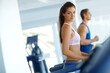 © Grady R/peopleimages.com - Woman, fitness and portrait with treadmill for training, workout or cardio exercise in gym. Runner, athlete or sports person ready with equipment for endurance, body goals and space in health club